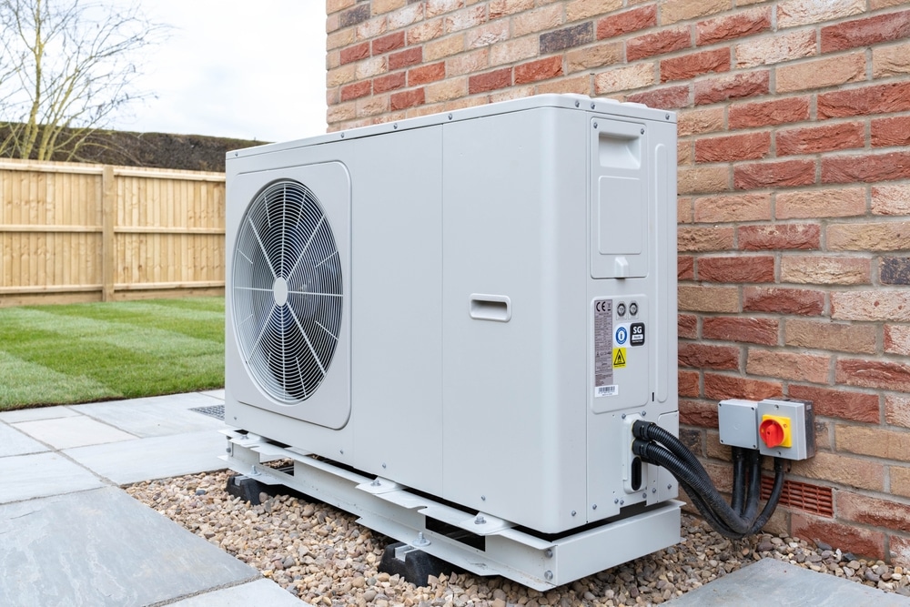 Air Source heat pump fitted outside a new home 
