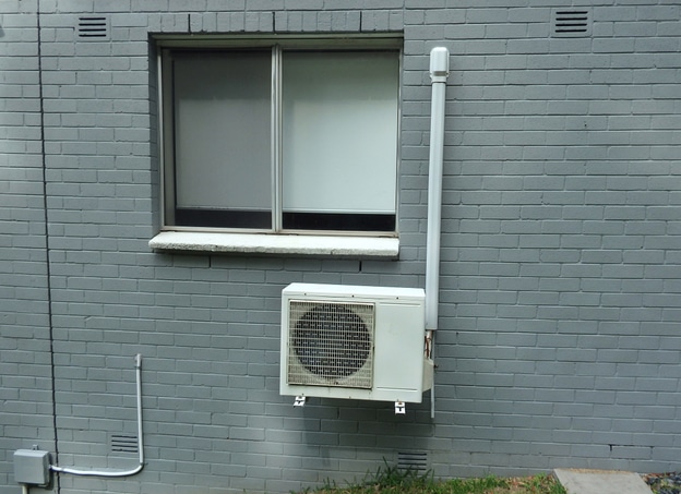 Example of ductless, Mini-Split Air Conditioner installed outside a home room.