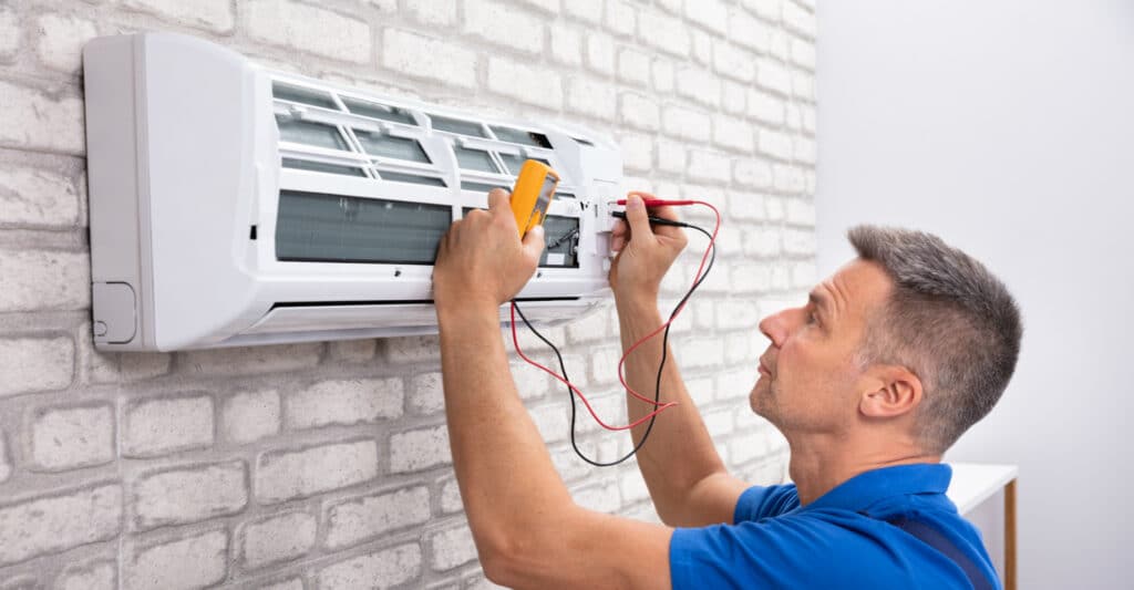 A close view of a person checking ac through a wired meter