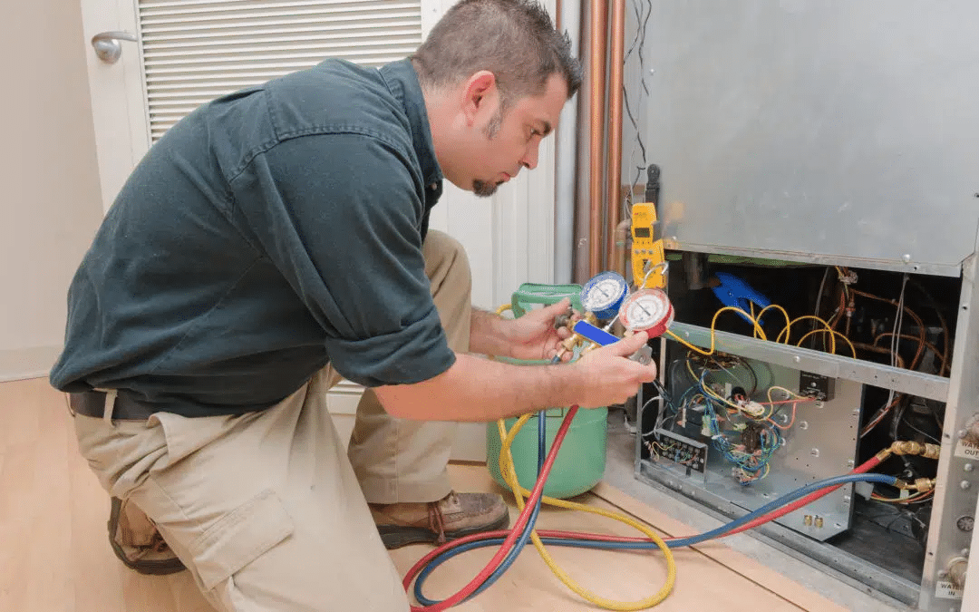 JLM technician inspecting an HVAC system in Gilbert, Arizona