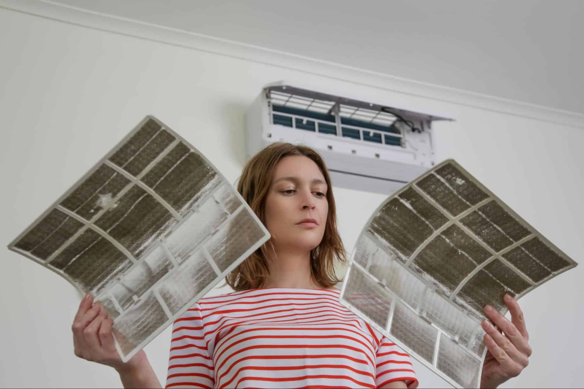A girl checking mold in the air ducts