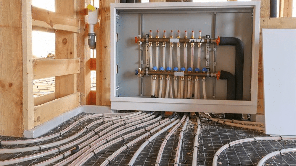 Hydronic heating system with floor pipes and control panel